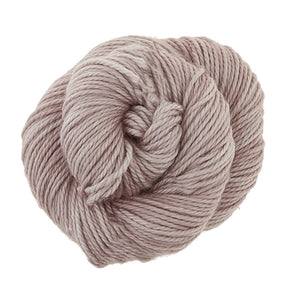 Skein of Madelinetosh TML Triple Twist Worsted weight yarn in color Smokestack (Gray) for knitting and crocheting.