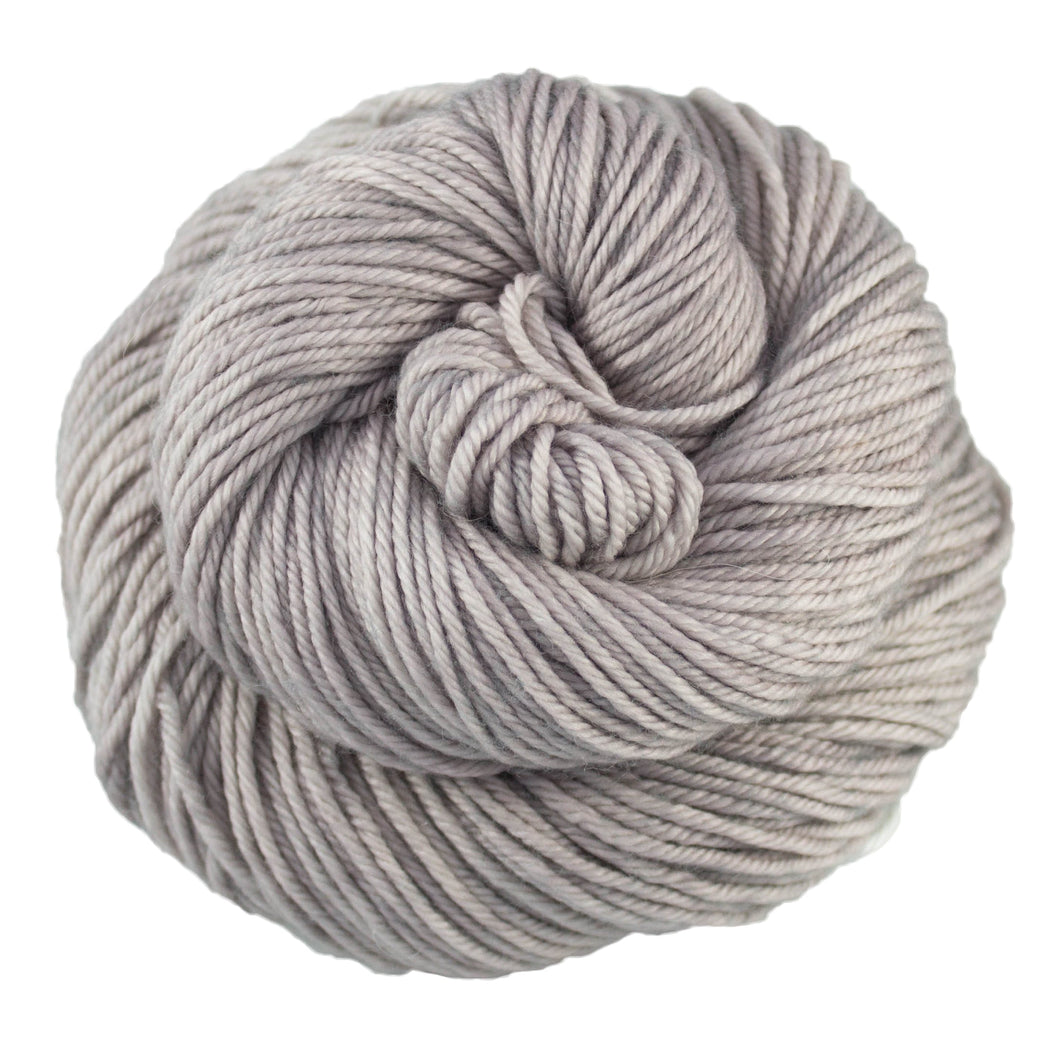 Skein of Malabrigo Caprino Sport weight yarn in color Pearl (Gray) for knitting and crocheting.
