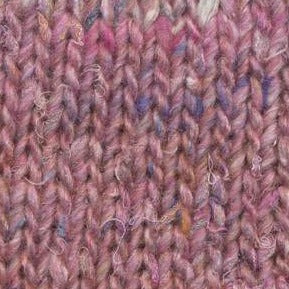Skein of Noro Silk Garden Solo Worsted weight yarn in color Oyabe (Pink) for knitting and crocheting.