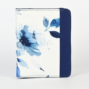 Knitter's Pride brand Blossom zippered, interchangeable needle case can store up to 24 needle tips. Blue and white, watercolor floral pattern cover with drak blue interior. The suede-like lining protects and a zippered interior pocket holds multiple cords. Compactly sized to fit neatly in a project case or purse, this is ideal for the traveling knitter.