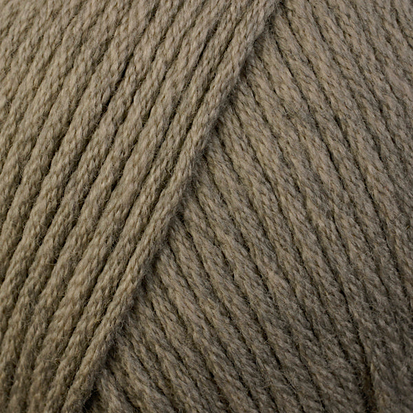 Skein of Berroco Comfort Worsted Worsted weight yarn in the color Driftwood Heather (Brown) for knitting and crocheting.