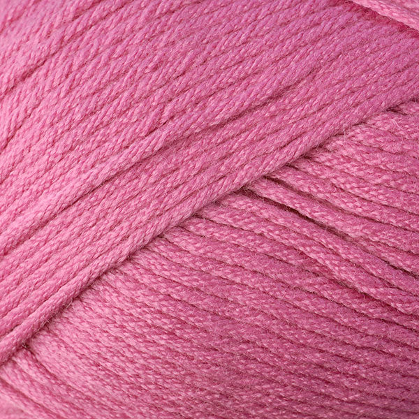Skein of Berroco Comfort Worsted Worsted weight yarn in the color Rosebud (Pink) for knitting and crocheting.