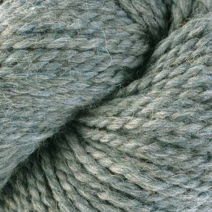 Skein of Berroco Ultra Alpaca Chunky Bulky weight yarn in the color Lunar Mix (Blue) for knitting and crocheting.