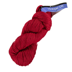 Skein of Berroco Vintage DK DK weight yarn in the color Cardinal (Red) for knitting and crocheting.