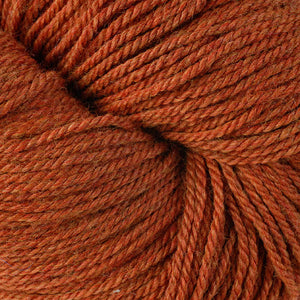 Skein of Berroco Vintage DK DK weight yarn in the color Pumpkin (Orange) for knitting and crocheting.