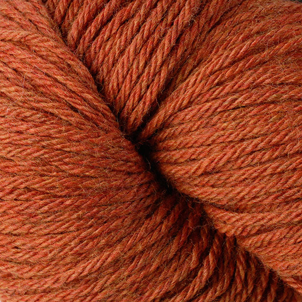 Skein of Berroco Vintage  Worsted weight yarn in the color Pumpkin (Orange) for knitting and crocheting.