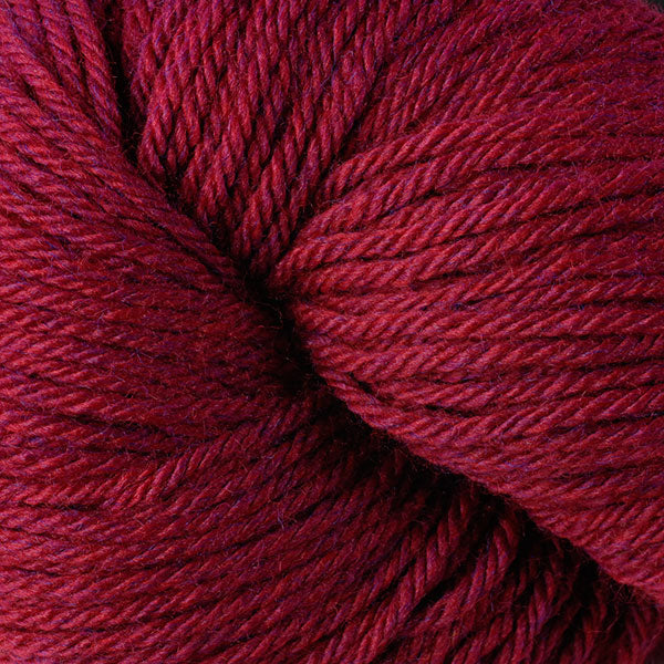 Skein of Berroco Vintage Worsted weight yarn in the color Ruby (Red) for knitting and crocheting.