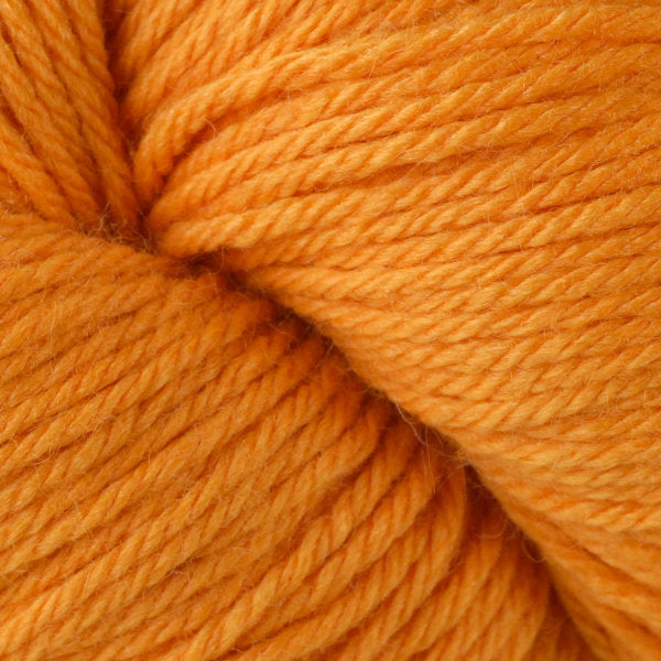 Skein of Berroco Vintage  Worsted weight yarn in the color Tangerine (Orange) for knitting and crocheting.