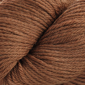 Skein of Cascade 220  weight yarn in the color Carob Brown (Brown) for knitting and crocheting.