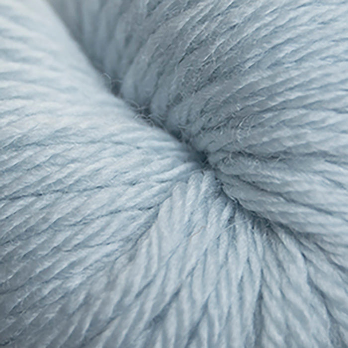 Skein of Cascade 220 Superwash Sport Sport weight yarn in the color Alaska Sky (Blue) for knitting and crocheting.