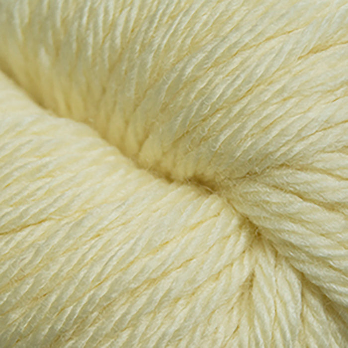 Skein of Cascade 220 Superwash Sport Sport weight yarn in the color Banana Cream (Yellow) for knitting and crocheting.