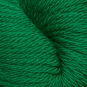 Skein of Cascade 220 Superwash Sport Sport weight yarn in the color Christmas Green (Green) for knitting and crocheting.