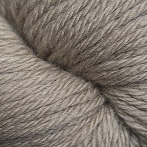 Skein of Cascade 220 Superwash Sport Sport weight yarn in the color Extreme Creme Cafe (Tan) for knitting and crocheting.