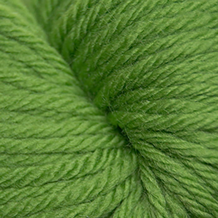 Skein of Cascade 220 Superwash Sport Sport weight yarn in the color Green Apple (Green) for knitting and crocheting.