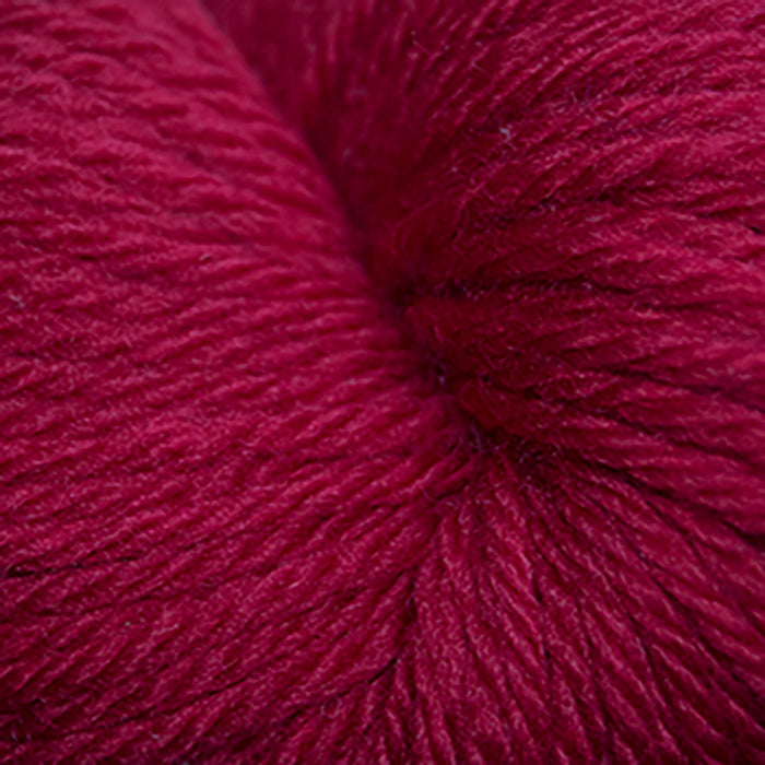 Skein of Cascade 220 Superwash Sport Sport weight yarn in the color Really Red (Red) for knitting and crocheting.