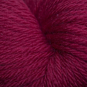 Skein of Cascade 220 Superwash Sport Sport weight yarn in the color Really Red (Red) for knitting and crocheting.