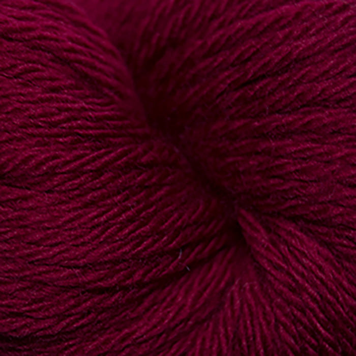 Skein of Cascade 220 Superwash Sport Sport weight yarn in the color Ruby (Red) for knitting and crocheting.