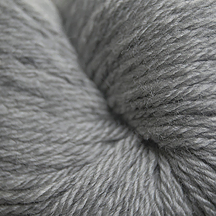 Skein of Cascade 220 Superwash Sport Sport weight yarn in the color Silver Grey (Gray) for knitting and crocheting.
