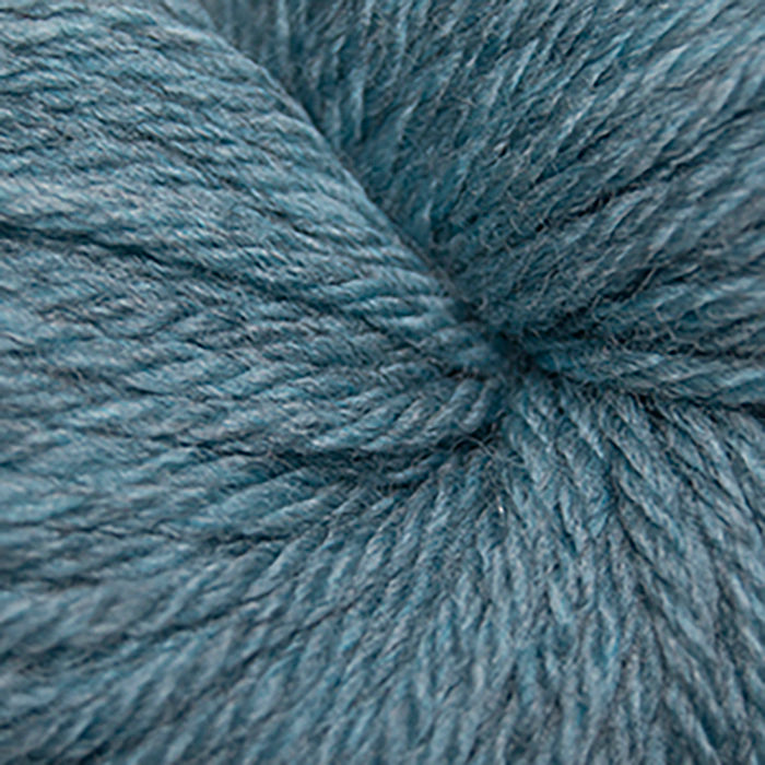 Skein of Cascade 220 Superwash Sport Sport weight yarn in the color Summer Sky Heather (Blue) for knitting and crocheting.