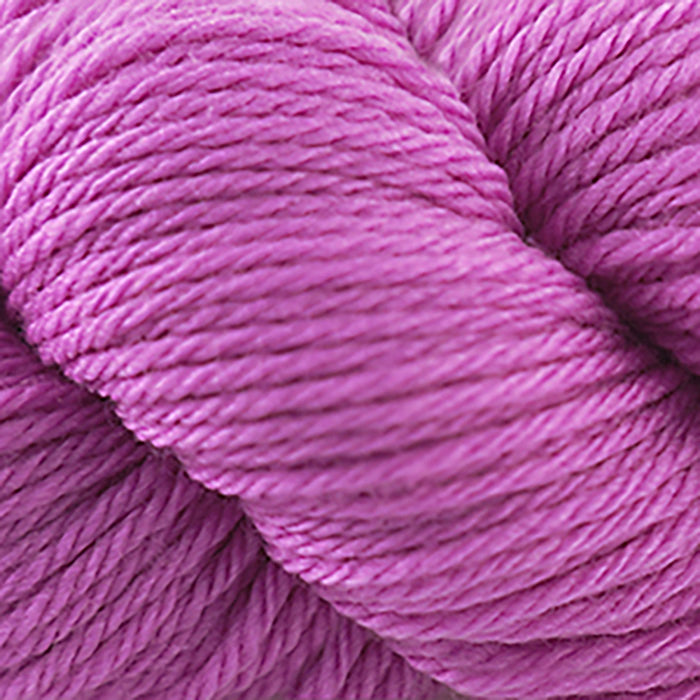 Skein of Cascade 220 Superwash Sport Sport weight yarn in the color Tahitan Rose (Pink) for knitting and crocheting.