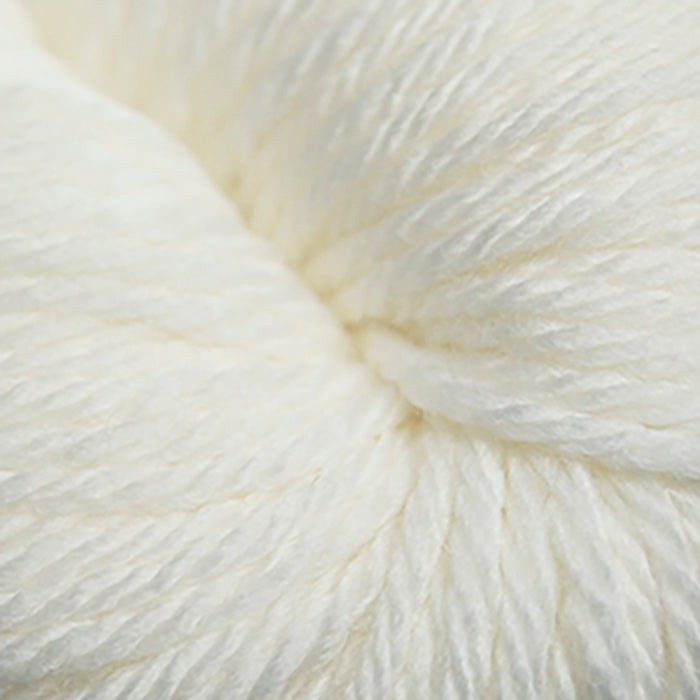 Skein of Cascade 220 Superwash Sport Sport weight yarn in the color White (White) for knitting and crocheting.