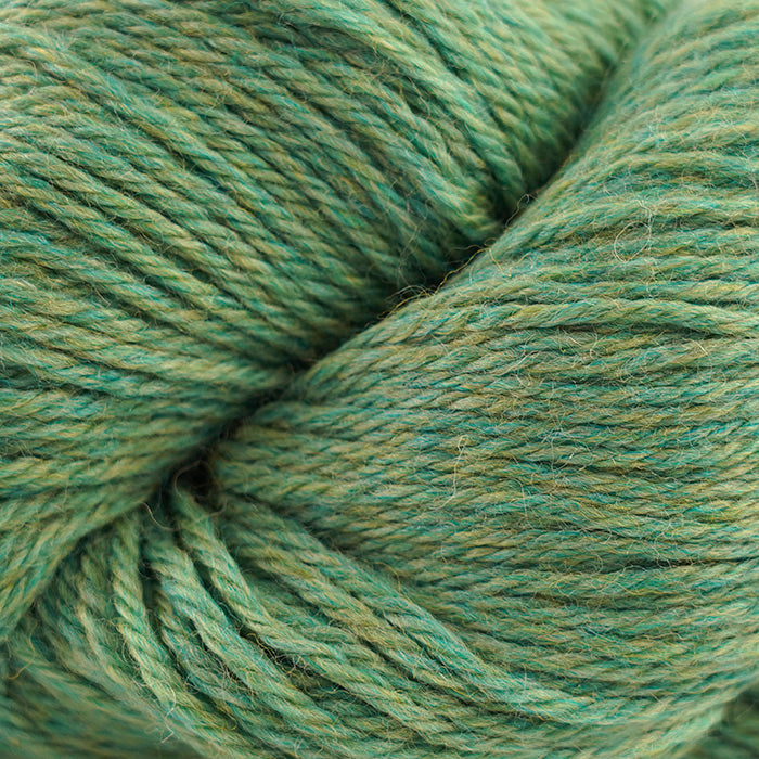Skein of Cascade 220 Worsted weight yarn in the color Aventurine Heather (Green) for knitting and crocheting.