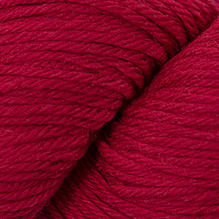 Skein of Cascade 220 Worsted weight yarn in the color Christmas Red (Red) for knitting and crocheting.