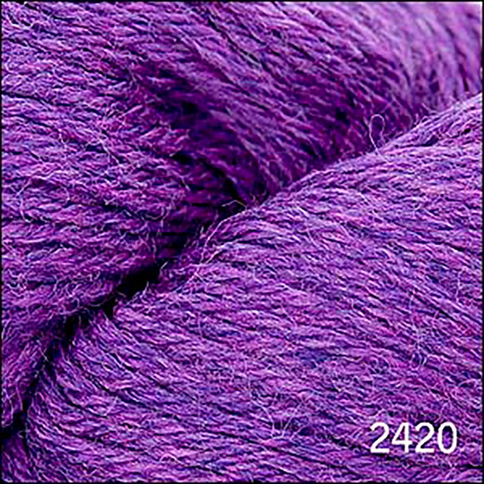 Skein of Cascade 220 Worsted weight yarn in the color Heather (Purple) for knitting and crocheting.