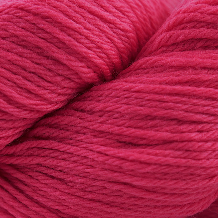 Skein of Cascade 220 Worsted weight yarn in the color Hot Pink (Pink) for knitting and crocheting.