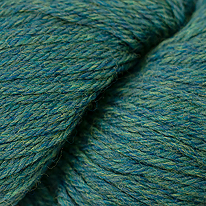 Skein of Cascade 220 Worsted weight yarn in the color Lake Chelan Heather (Green) for knitting and crocheting.