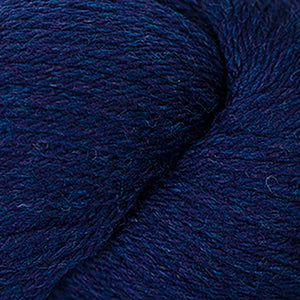 Skein of Cascade 220 Worsted weight yarn in the color Midnight Heather (Blue) for knitting and crocheting.