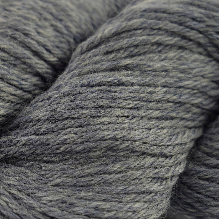 Skein of Cascade 220 Worsted weight yarn in the color Storm Cloud Heather (Gray) for knitting and crocheting.