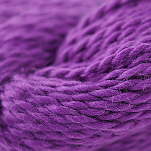 Skein of Cascade Baby Alpaca Chunky Bulky weight yarn in the color Grape Juice (Purple) for knitting and crocheting.