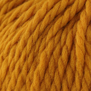 Skein of Cascade Llana Grande Super Bulky weight yarn in the color Artisan Gold (Yellow) for knitting and crocheting.