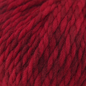 Skein of Cascade Llana Grande Super Bulky weight yarn in the color Crimson (Red) for knitting and crocheting.