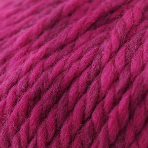 Skein of Cascade Llana Grande Super Bulky weight yarn in the color Hot Rod Pink (Pink) for knitting and crocheting.