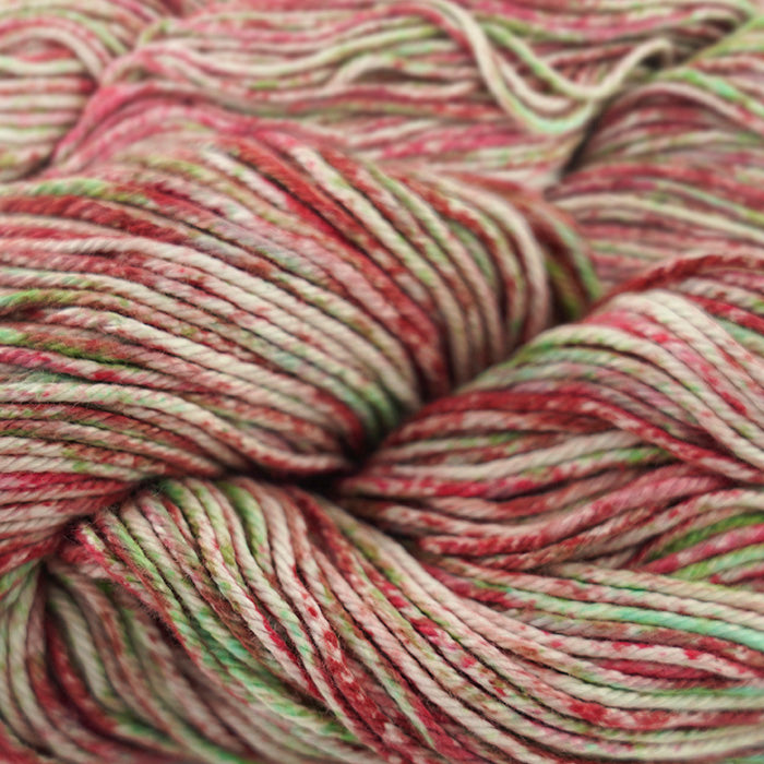 Skein of Cascade Nifty Cotton Splash Worsted weight yarn in the color Holidaze (Red) for knitting and crocheting.