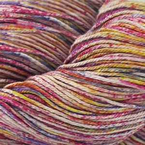 Skein of Cascade Nifty Cotton Splash Worsted weight yarn in the color Petunia (Multi) for knitting and crocheting.