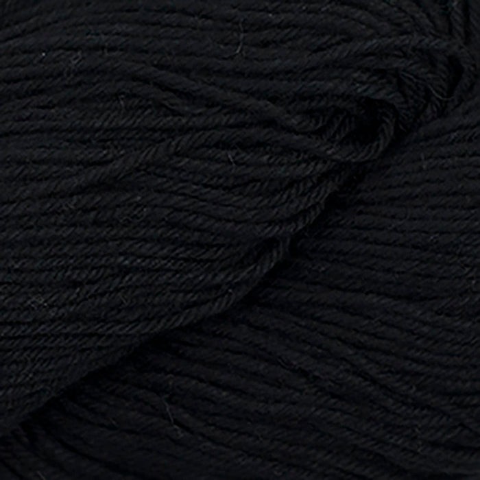 Skein of Cascade Nifty Cotton Worsted weight yarn in the color Black (Black) for knitting and crocheting.