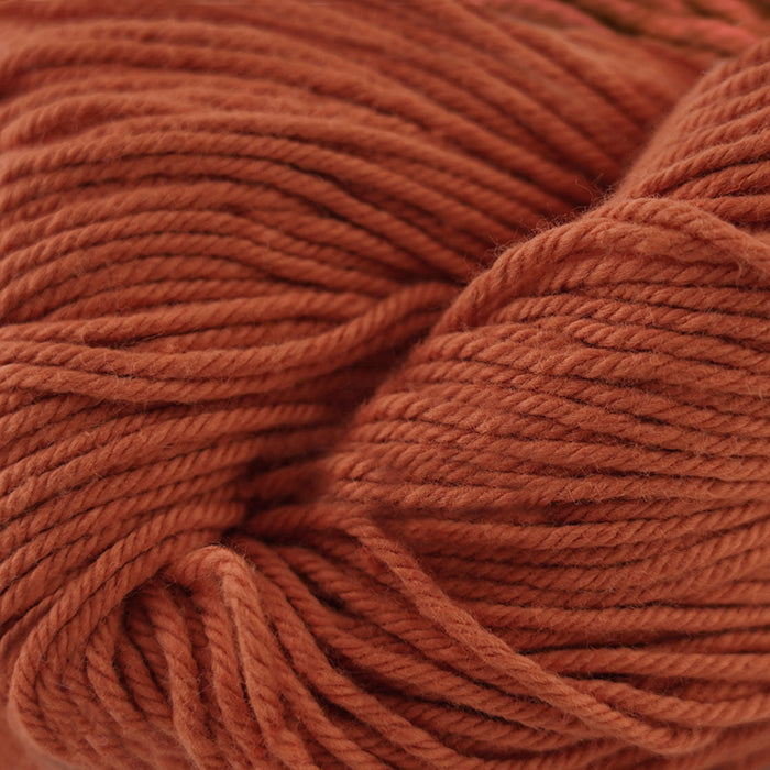 Skein of Cascade Nifty Cotton Worsted weight yarn in the color Terra Cotta (Orange) for knitting and crocheting.