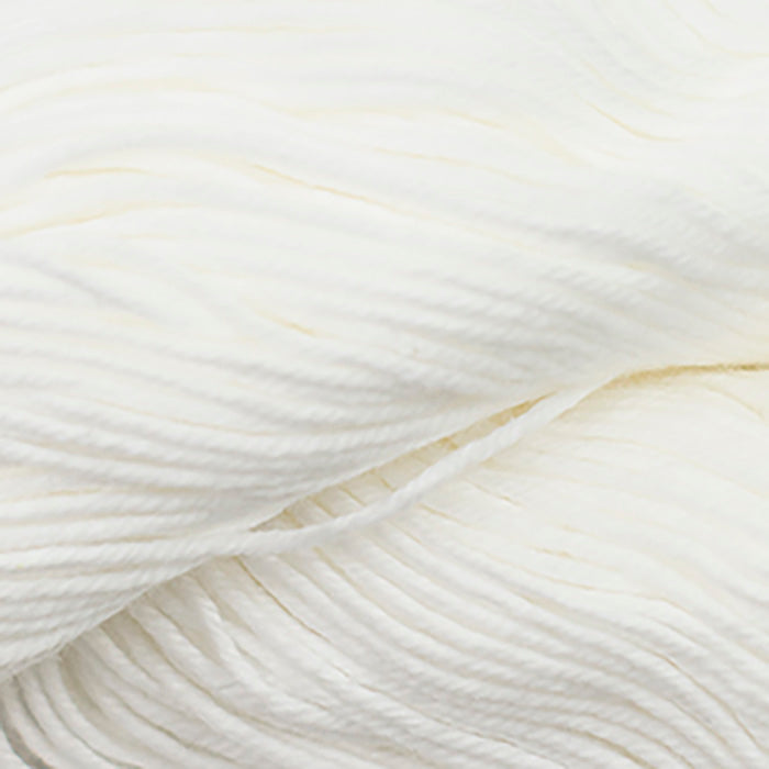 Skein of Cascade Nifty Cotton Worsted weight yarn in the color White  (White) for knitting and crocheting.