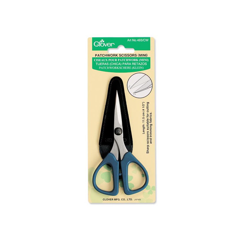 A pair ofclover mini patchwork scissors and the leather sheath that protects the blades are shown in the Clover packaging.