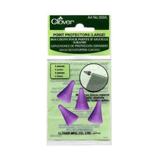 Load image into Gallery viewer, Set of 4 Clover Point Protectors for medium-sized knitting needles in packaging
