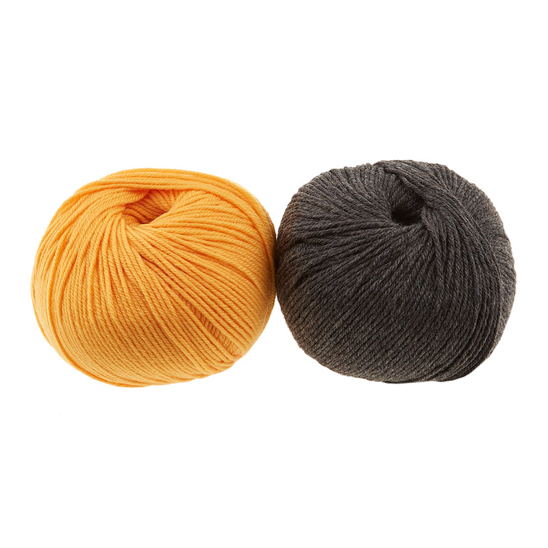 Two balls of Cascade 220 Superwash are shown, in colors Gold Fusion and Charcoal.