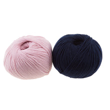 Load image into Gallery viewer, Two balls of Cascade 220 Superwash are shown, in colors Strawberry Cream and Navy.
