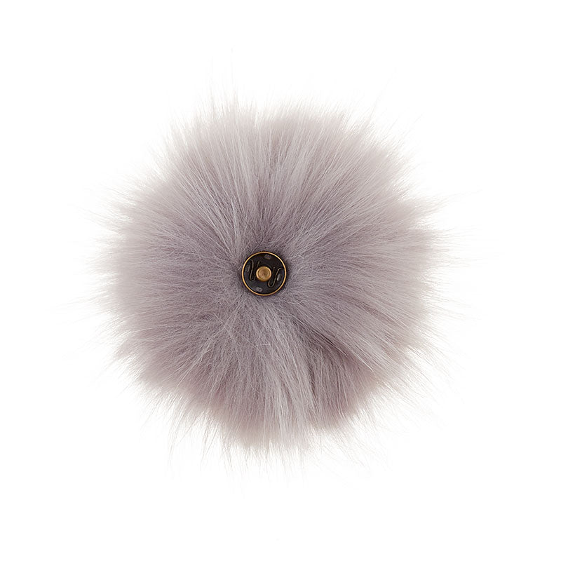 A soft and fuzzy, faux(fake) fur pom pom with a built-in snap on attachment that makes it easy to add to, and remove from, any project. This pom pom is dove grey.