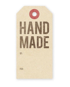 A vintage style gift tag reading "HAND MADE" In large block font.