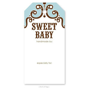 A gift tag is shown with the words Sweet Baby and a decorative scroll with blue colorblocking.