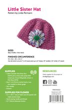 Load image into Gallery viewer, A pattern cover shows a flat shot of a crocheted purple hat with blue fabric flower.
