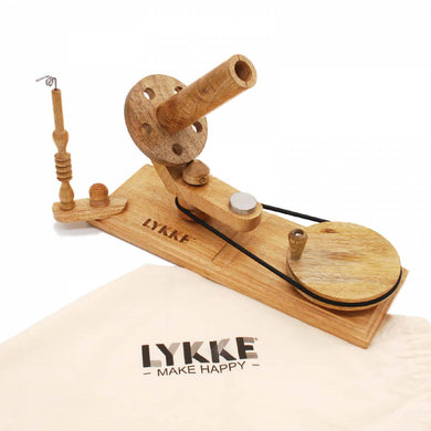 A hand crafted ball winder in Mango Wood  finish from Lykke Crafts